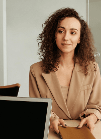 Professional woman holding documents.
